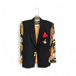 Black two piece suit with red pocket square, printed sleeves